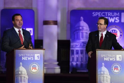 Kentucky State Auditor Mike Harmon, right, listens as Somerset, Ky., Mayor Alan Keck responds to a question during the Kentucky Gubernatorial GOP Primary Debate in Louisville, Ky., Tuesday, March 7, 2023. (Photo provided | Timothy D. Easley via Associated Press