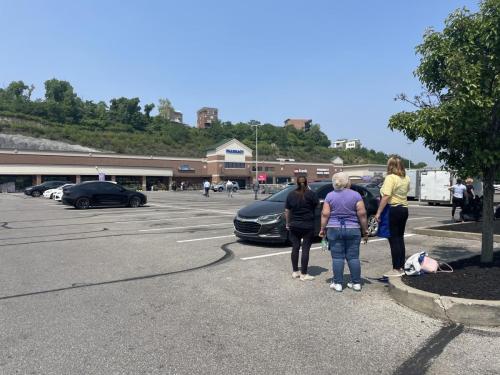 People wait outside the Newport Kroger after it was evacuated. LINK nky staff photo